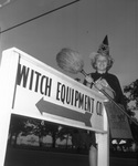 Debbie Duncan, 10, of Arlington, Texas; Witch Equipment Company sign for Ditch Witch trenching machines