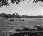 Dirt leveling by tractors in construction of Six Flags Over Texas, Arlington, Texas