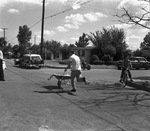 Hospital test run race between wheelbarrow from downtown Arlington, Texas to promote Arlington Memorial Hospital site vs ambulance trip to hospital in Fort Worth, Texas