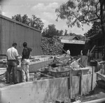 Men constructing cave ride at Six Flags Over Texas