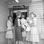 Six Flags female employees standing outside wardrobe room at Six Flags Over Texas