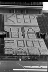 University of Texas at Arlington (U. T. A.) students in Maverick stadium creating sign "Keep University of Texas at Arlington (U. T. A.) football"