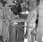 Visitor to Six Flags Over Texas having hand stamped upon entrance to park on opening day of season