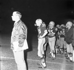 Lamar High School coach Peach with football players