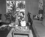 Miller Brinkley decorating a Christmas tree, Arlington, Texas