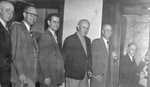 The first dialed telephone call being made from a telephone booth, possibly in Arlington, Texas