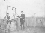 Edwin P. Barclay with two boys at a well on Fort Worth's Northside