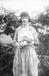 Elsie Barclay Griffin holding a bouquet of flowers