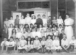 Elsie Barclay with her teacher Miss Lena Edwards and class at school