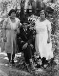 Portrait of a Mexican man and two Mexican women. by Basil Clemons 1887-1964