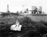 Baby on blanket in Mexican Town, Breckenridge, Texas. by Basil Clemons 1887-1964