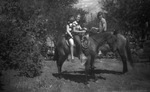 Three children on horses by Basil Clemons 1887-1964