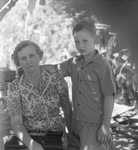 A woman posed with a boy by Basil Clemons 1887-1964