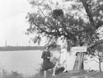 Candid picture of women by a lake by Basil Clemons 1887-1964