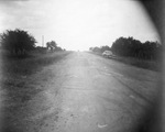 Road with a parked car by Basil Clemons 1887-1964