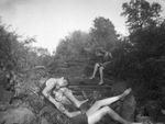 Women posing on rocks by Basil Clemons 1887-1964