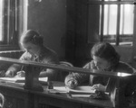 Breckenridge High School, classroom, undated. Two female students studying. by Basil Clemons 1887-1964