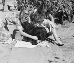 Candid picture of women with a dog by Basil Clemons 1887-1964