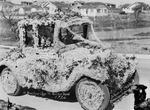 A car covered with flowers, decorated by West Texas Decorating Co. by Basil Clemons 1887-1964