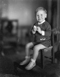 Portrait of a boy by Basil Clemons 1887-1964