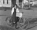 Portrait of a girl with a bike by Basil Clemons 1887-1964