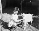 Portrait of a child and a sheep by Basil Clemons 1887-1964