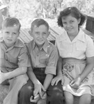 Portrait of two boys and one girl by Basil Clemons 1887-1964