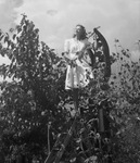 Portrait of a woman in plants by Basil Clemons 1887-1964