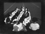 Students in three lines performing at a football game by Basil Clemons 1887-1964