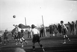 A group of young women playing volleyball by Basil Clemons 1887-1964