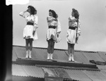 Three baton-twirling majorettes, Breckenridge High School, Breckenridge, Texas by Basil Clemons 1887-1964