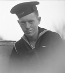 A man posing in a United States Navy uniform by Basil Clemons 1887-1964