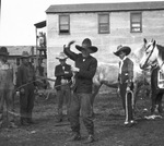 A cowboy performs with a lasso by Basil Clemons 1887-1964