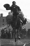 A cowboy rides a bucking bronco by Basil Clemons 1887-1964