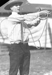 A cowboy performs with a lasso by Basil Clemons 1887-1964