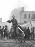 A cowboy rides a bucking bronco by Basil Clemons 1887-1964