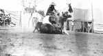 A cowboy working two horses at a rodeo by Basil Clemons 1887-1964