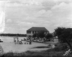 A large wooden building used by visitors to Lake de La Fosse by Basil Clemons 1887-1964