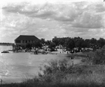 A large wooden building used by visitors to Lake de La Fosse by Basil Clemons 1887-1964