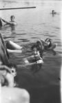 Several young people pose while swimming in a lake by Basil Clemons 1887-1964