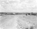 A dirt road leading to a farm by Basil Clemons 1887-1964