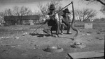 Two crouching men with three rattlesnakes by Basil Clemons 1887-1964