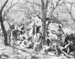 A group of rattlesnake hunters poses in the woods by Basil Clemons 1887-1964