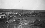 A small town with oil derricks by Basil Clemons 1887-1964