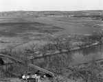 A bridge for automobile traffic crosses a river, possibly the Brazos River by Basil Clemons 1887-1964