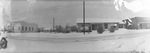 A snowy street scene. by Basil Clemons 1887-1964