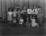 A group of people holding gardening and canning tools by Basil Clemons 1887-1964