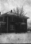 A large two story house after a snow storm by Basil Clemons 1887-1964