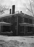 A large two story house after a snow storm by Basil Clemons 1887-1964