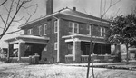 A large two story house after a snow storm by Basil Clemons 1887-1964